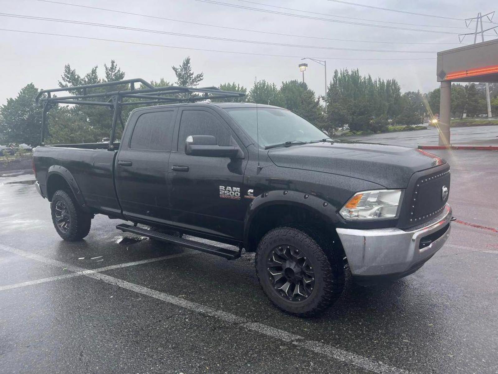 2015 Black Forest Green Pearlcoat /Gray RAM 2500 TRADESMAN CREW CAB LWB ST (3C6UR5HL2FG) with an 6.7L engine, Automatic transmission, located at 1505 S 356th St., Federal Way, WA, 98003, 47.282051, -122.314781 - This Ram 2500 Cummins TurboDiesel 4x4 has a beautiful Black Forest Green Pearlcoat exterior like you've never seen before - ONE OF A KIND! Gooseneck towing package with air suspension, custom grill, running boards, powder coated wood rack. Brand new Rotors and Pads Drilled and slotted, straight pipe - Photo #3